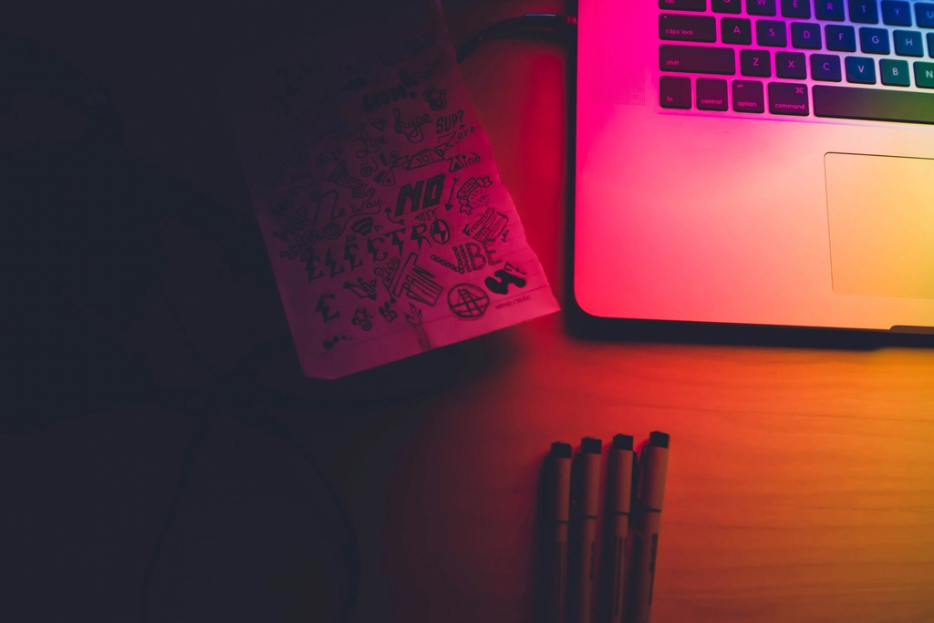 Designer workspace with laptop and desk